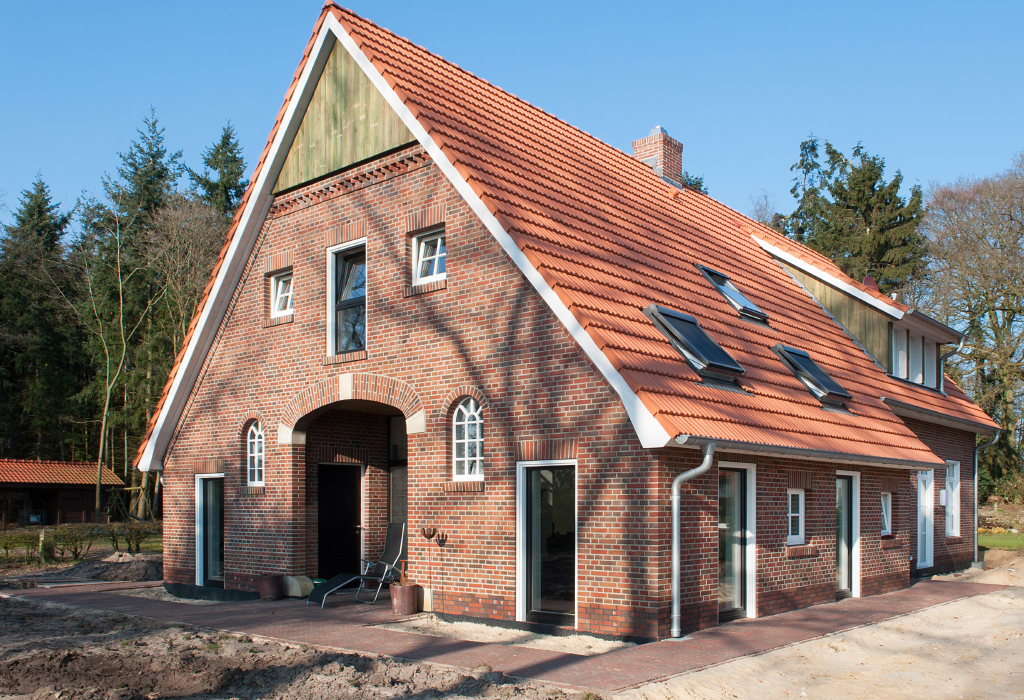 Renovated farm house with a red brick facade