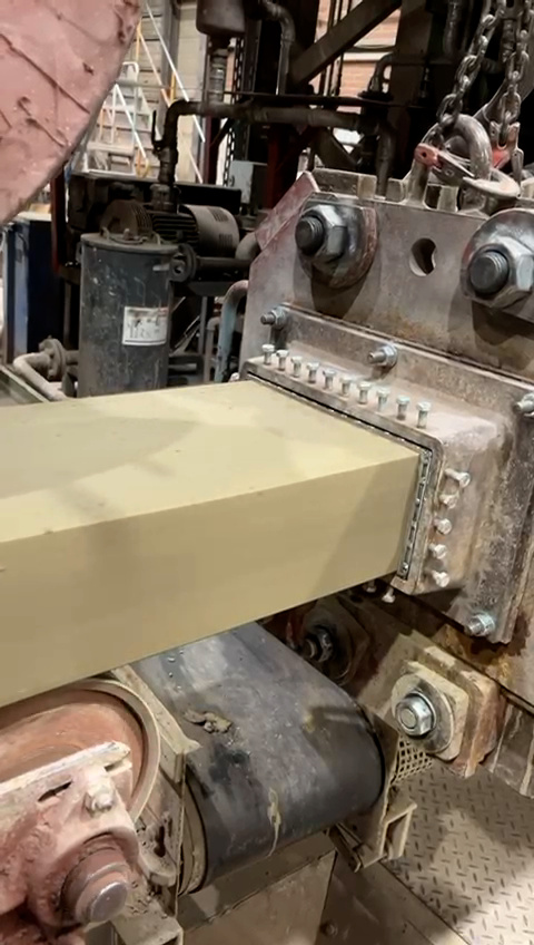 The newly processed raw material extruded into a continuous strand